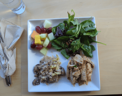 Client X's food-journal photo of a mixed meal with salad and fruit