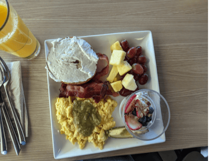 Client X's later food-journal breakfast photo with eggs, toast and fruit